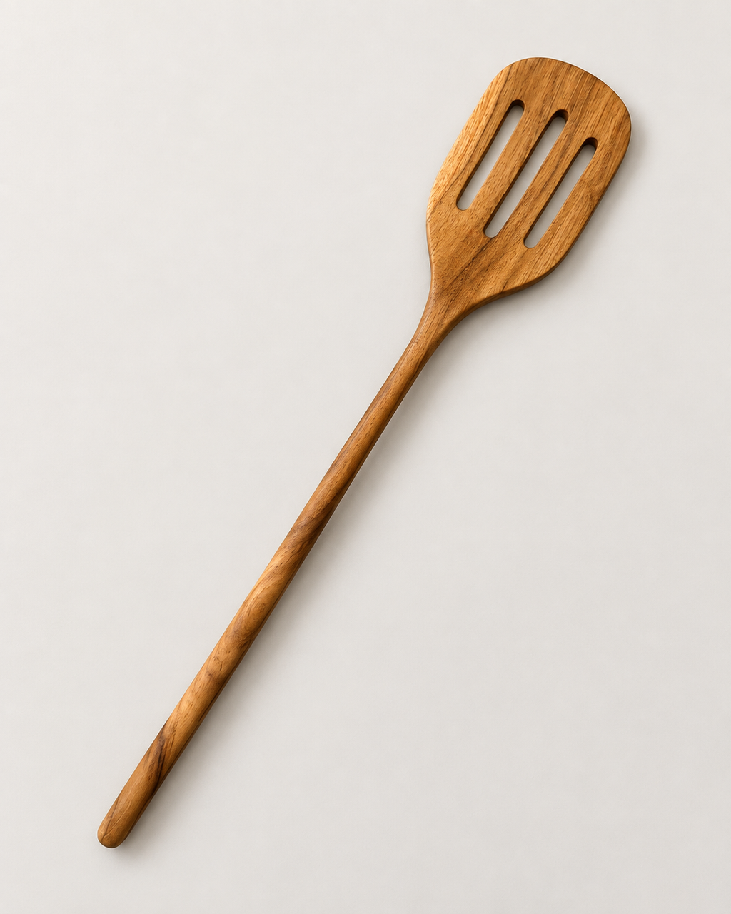 Spatule ajourée en bois de teck