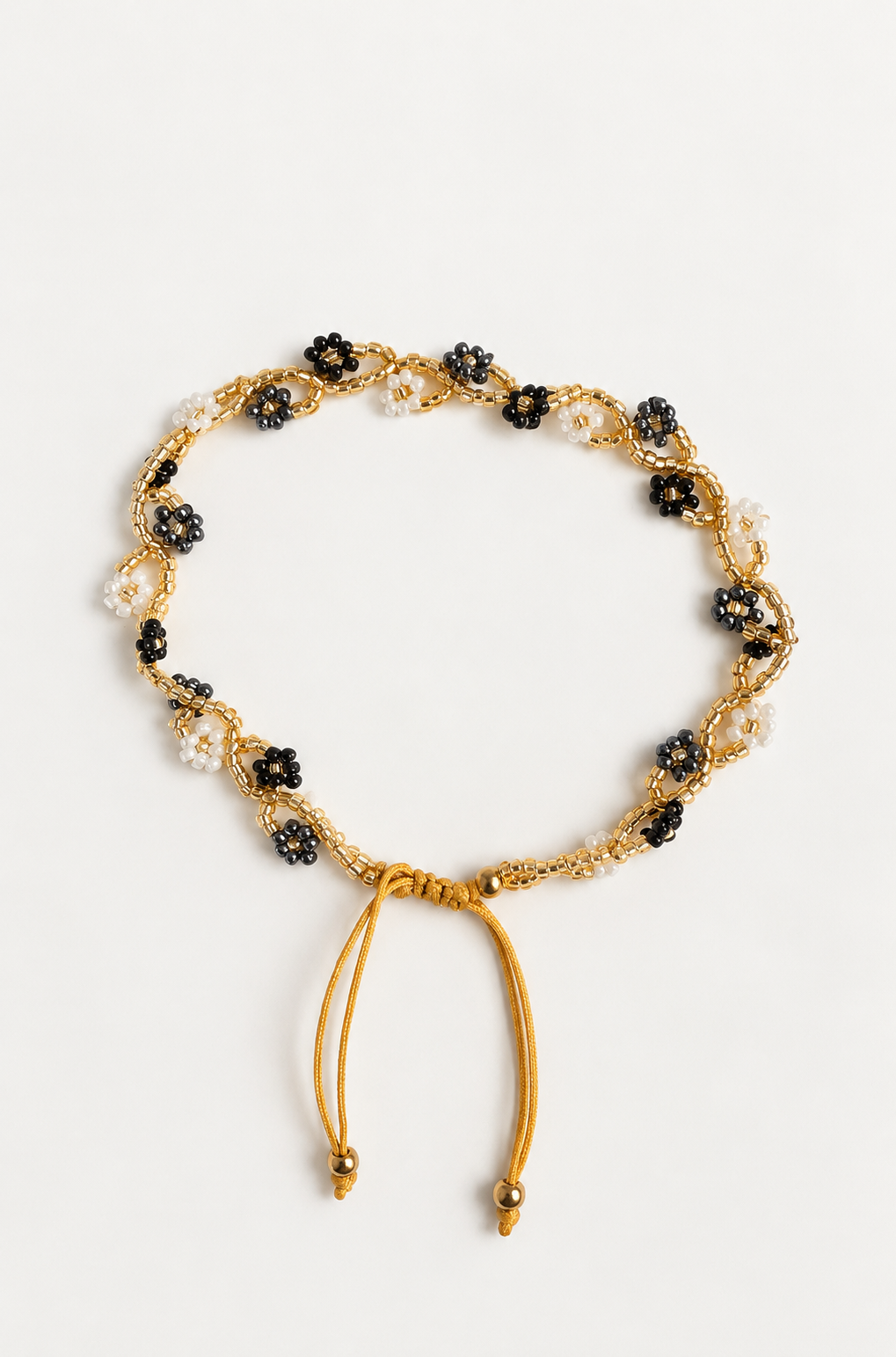Bracelet de cheville fleuri noir, gris, blanc